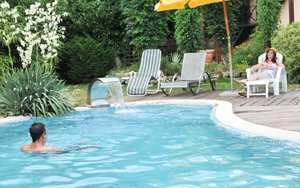 18 year old female Doris G slips off her underwear to pose naked on her bed